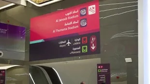 Signs with Arabic to English translation at Doha airport